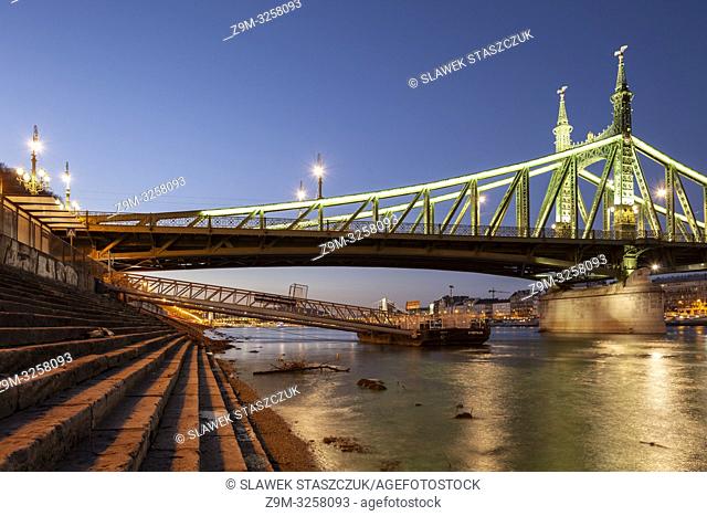 Night falls at Liberty Bridge across the Danube in Budapest, Hungary