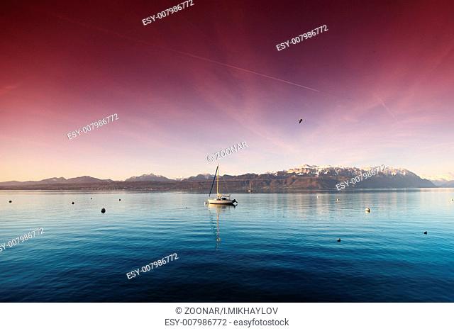 yacht in lake of geneva landscape on sunrise
