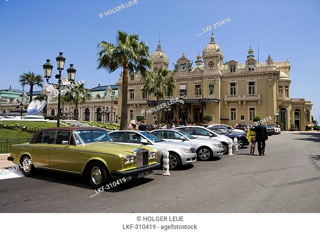 Luxury cars parked outside Monte Carlo Casino, Monte Carlo, Monaco