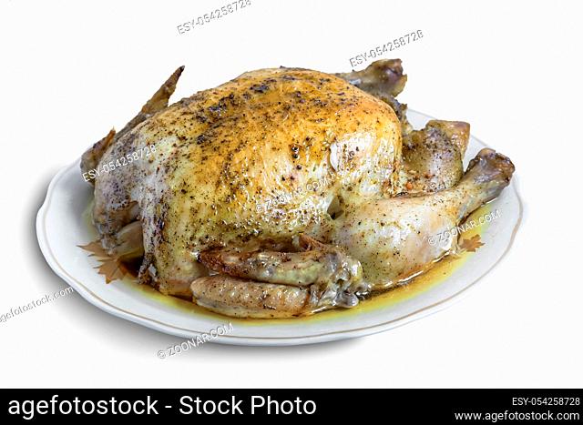 On a white plate of fried chicken, flavored with spices. Presented on a white background