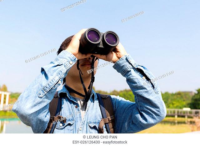 Man using binoculars for birdwatching