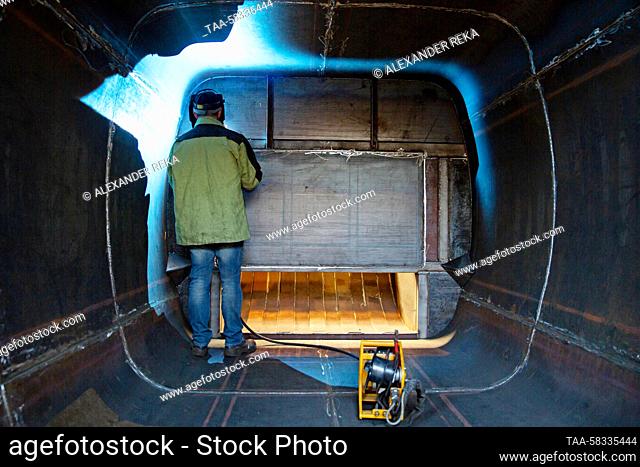 RUSSIA, LUGANSK - APRIL 10, 2023: A welder is at work at a welding shop of the Lugamash machine building enterprise. The enterprise, established in 2015
