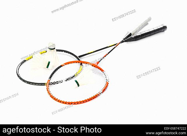 Badminton rackets and feather shuttlecocks isolated on white background