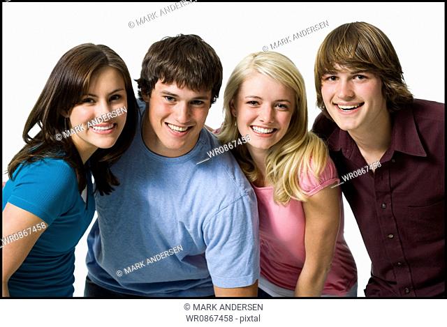 Four people smiling
