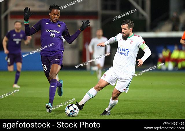 Anderlecht's Christian Kouame and OHL's Xavier Mercier fight for the ball during a soccer match between OHL Oud-Heverlee-Leuven and RSC Anderlecht
