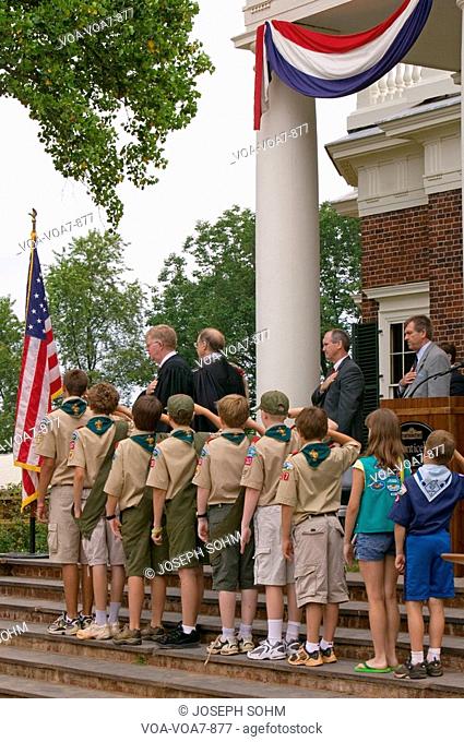 Boy Scouts and judge saying the Pledge of Allegiance with 76 new American citizens at Independence Day Naturalization Ceremony on July 4