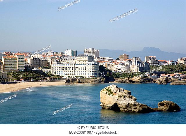 The Basque seaside resort on the Atlantic coast. The Grande Plage with the Bellevue Conference Centre in the middle and the Pyrenees mountains in the distance