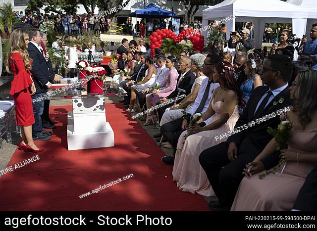 14 February 2023, Venezuela, Caracas: Couples and guests participate in a collective wedding ceremony organized by the Municipality of the Chacao neighborhood...