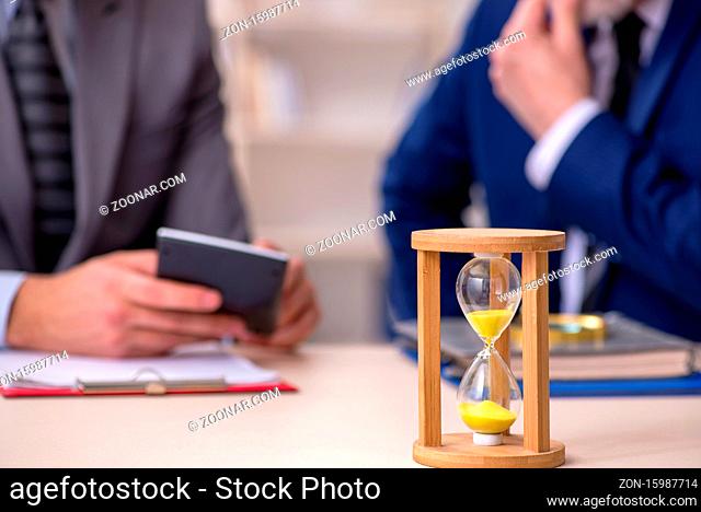 Two businessmen in the time management concept