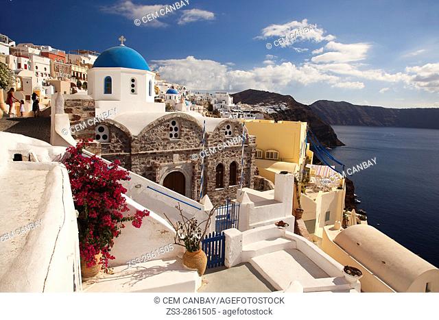 View to the blue domed churches in the Oia village by the cliff, Santorini, Cyclades Islands, Greek Islands, Greece, Europe