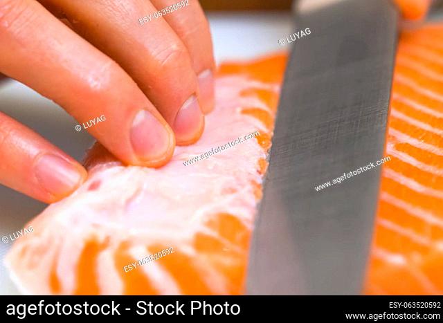 a Butchering salmon, piece of salmon red fish meat
