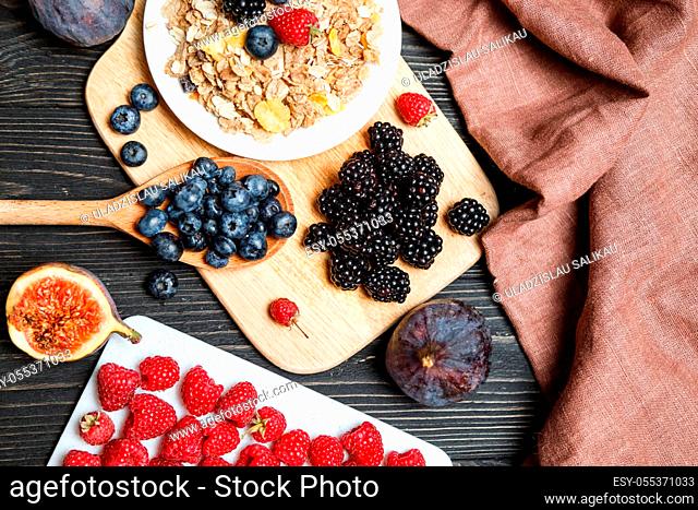 Healthy breakfast with muesli and berries. Top view, flat lay