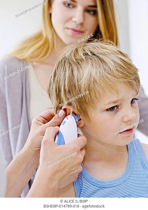 Doctor measuring a child's temperature