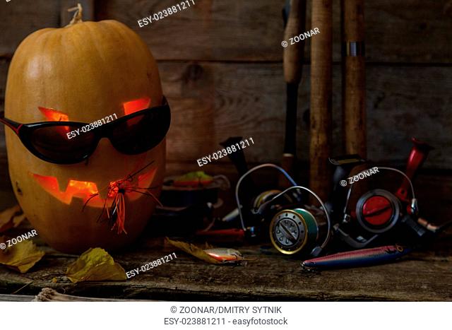 halloween pumpkin head with fishing tackles