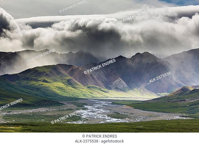 Stormy clouds over the Alaska range mountains of the East fork Toklat river, Denali National Park, interior, Alaska