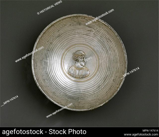 Bowl with a male bust within a medallion. Period: Sasanian; Date: ca. A.D. early 4th century; Geography: Iran; Culture: Sasanian; Medium: Silver; Dimensions:...