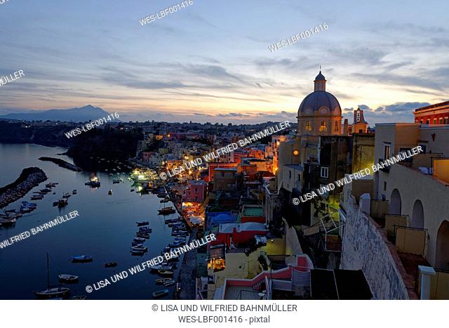 Italy, Campania, Phlegraean Islands, Procida, Marina di Corricella at evening twilight