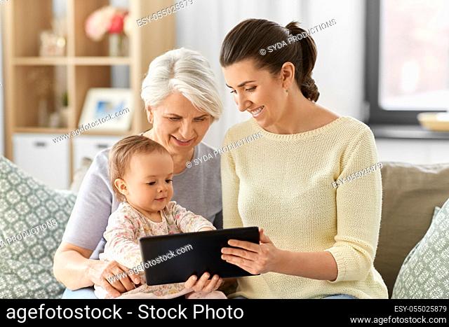 mother, daughter and grandma with tablet pc