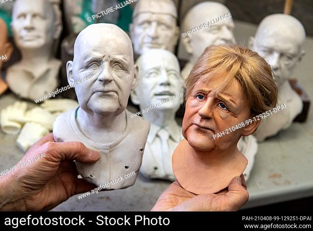 08 April 2021, Saxony, Lichtenstein: In her workshop in Lichtenstein, Brigitte Schneider is busy working on portrait heads depicting Chancellor Merkel