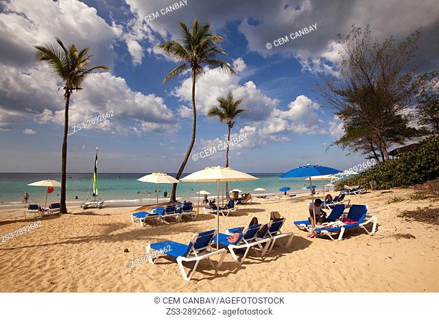 Scene from the Santa Maria del Mar beach with sunbeds and umbrellas in the foreground, Playas del Este, La Habana, Cuba, West Indies, Central America