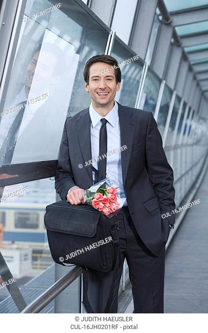 businessman with flowers, happy