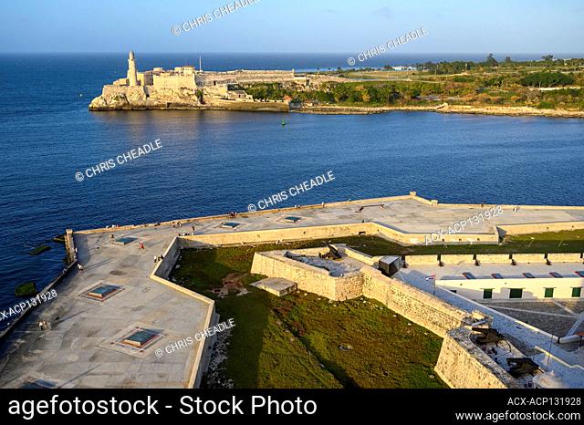 Harbour entrtance on Malecon, El Castillo de los Tres Reyes Magos del Morro or simply “El Morro” in the distance, Havana Vieja, Cuba