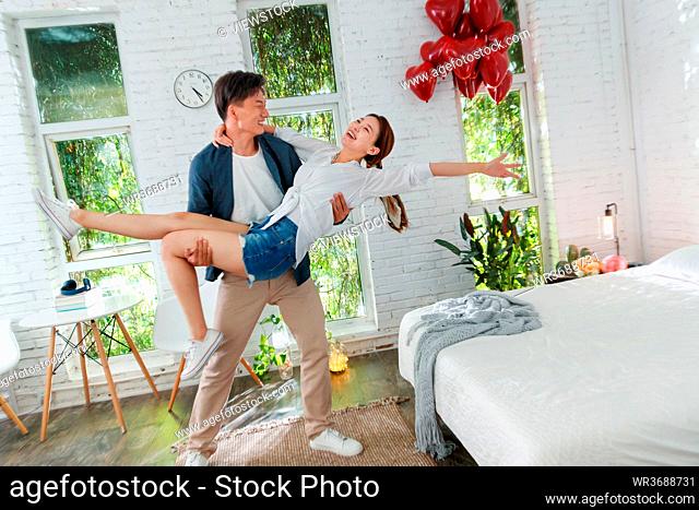 Happy young couples in the bedroom
