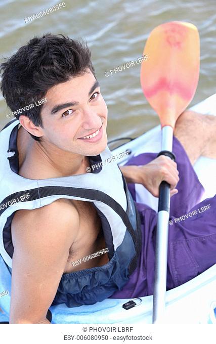 Teenage boy in canoe