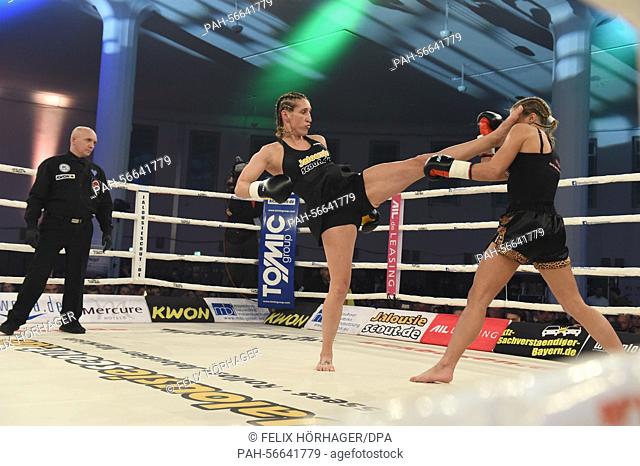 German kickboxer Julia Irmen (L) fights against Mellony Geugjes of the Netherlands in the WKU World Championship in kickboxing at Stekos Fight Night in the...