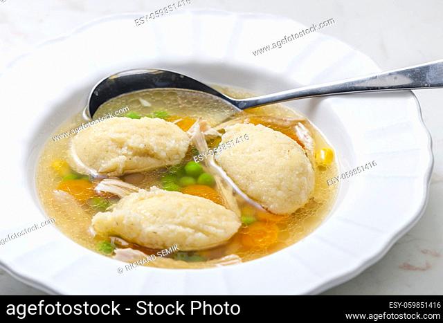 chicken broth with semolina dumplings and vegetables