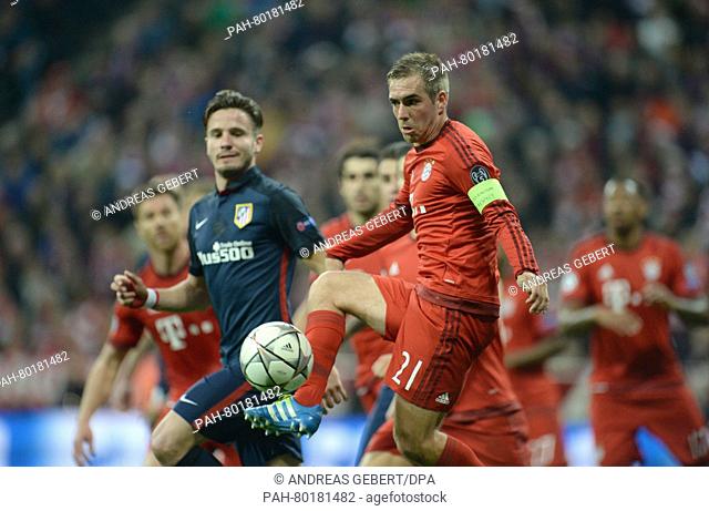 Munich's Philipp Lahm (front) in action during the UEFA Champions League semi final second leg soccer match between Bayern Munich and Atletico Madrid at the...