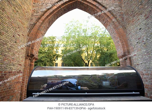 11 September 2019, Berlin: In the ruins of the Franciscan monastery you can lie in a glass coffin. The capsule is part of the exhibition ""Playground - for...