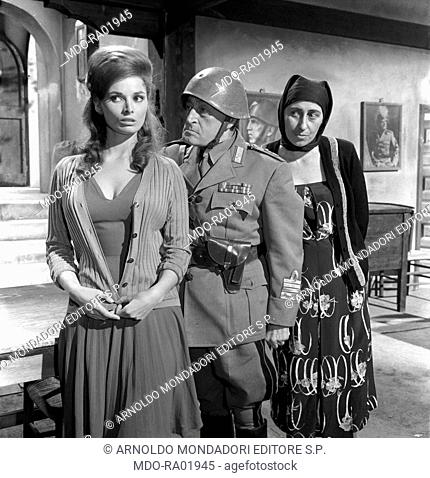 Italian actors Totò (Antonio De Curtis) and Adriana Facchetti looking at Italian actress Scilla Gabel (Gianfranca Gabellini) in the film The Two Colonels