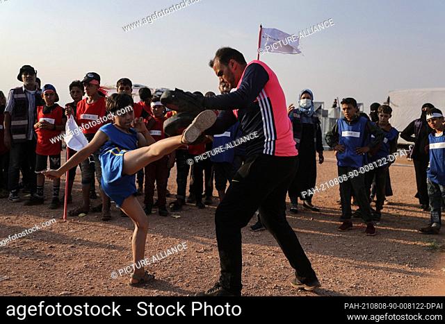 07 August 2021, Syria, Idlib City: A Syrian child plays Taekwondo as part of a small-scale Olympic-style event held for internally displaced children by...