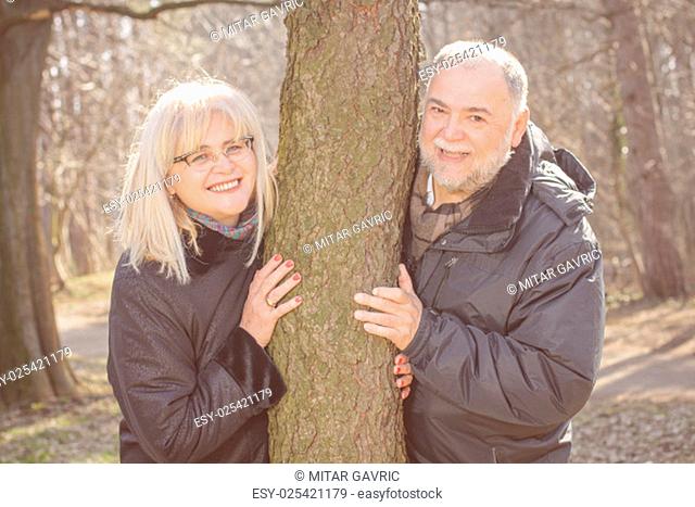 Happy Elderly Senior Romantic Couple in nature, Old people portrait outdoor winter autumn season