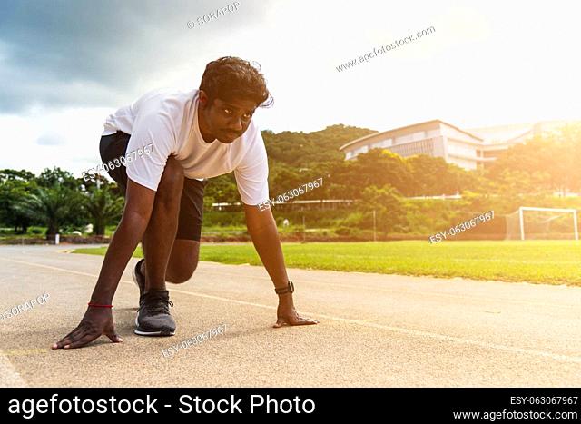 Asian young athlete sport runner black man wear feet shoe active ready to start running training at the outdoor on the treadmill for a step forward