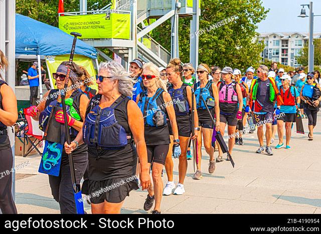 Dragon Boat team heading to their boat at the Richmond Festival in British Columbia Canada