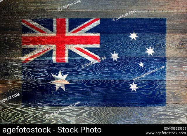 An Australia flag on rustic old wood surface background