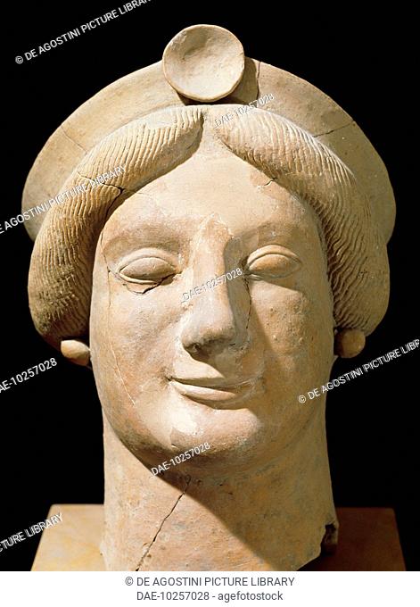 Female head in terracotta, from the ancient city of Medma, Calabria, Italy. Greek civilisation, 6th-5th century BC.  Reggio Di Calabria