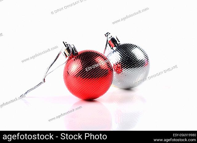 Christmas balls with ornaments on white background