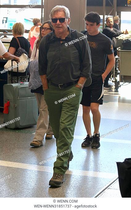 Harrison Ford and Calista Flockhart arrive at Los Angeles International (LAX) Airport to catch a flight with their son Liam Featuring: Harrison Ford
