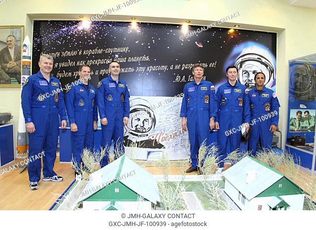 At the historic museum near the launch pad at the Baikonur Cosmodrome in Kazakhstan, the Expedition 3132 backup and prime crews pose for pictures May 11