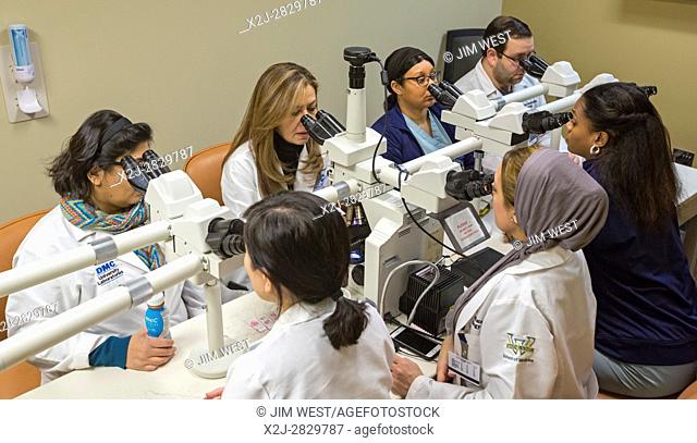 Detroit, Michigan - Dr. Rouba Ali (far side, second from left), a pathologist, teaches a class at the Detroit Medical Center. Dr
