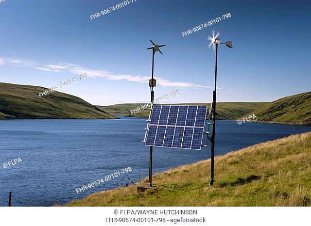 Combination of solar panels and wind turbines, harnessing renewable energy to produce electricity at remote reservoir, Elan Valley, Powys, Wales, July