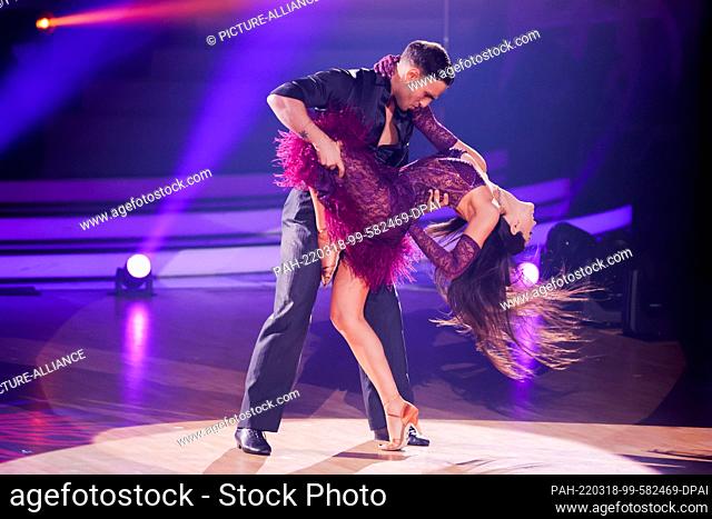 18 March 2022, North Rhine-Westphalia, Cologne: Timur Ìlker, actor, Malika Dzumaev, professional dancer, dance in the RTL dance show ""Let's Dance"" in the...