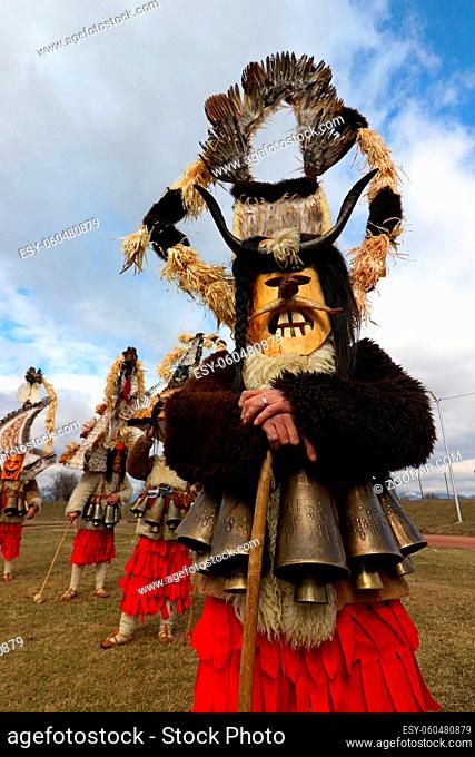 Elin Pelin, Bulgaria - February 15, 2020: Masquerade festival in Elin Pelin, Bulgaria. People with mask called Kukeri dance and perform to scare the evil...