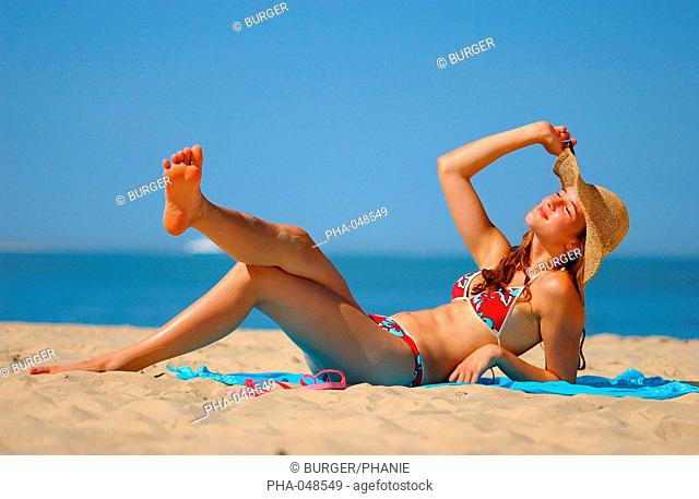 Woman sunbathing at the beach