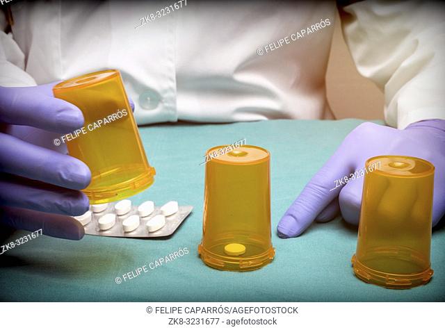 Doctor plays to Thimblerig with bottles of medicine, conceptual image