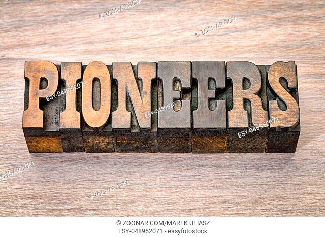 pioneers banner - text in vintage letterpress wood type - French Clarendon font popular in western movies and memorabilia