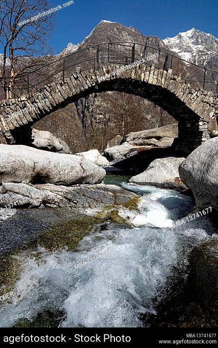 In a tiny side valley of the Valle Maggia, this ancient stone bridge spans a small mountain stream
